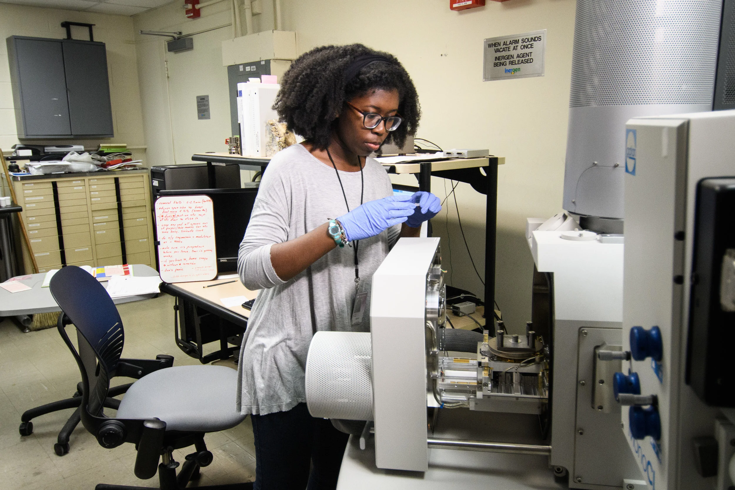 Pomona College student D'Maia Curry works with an electron microscope at the Smithsonian National Museum of Natural History in Washington, DC.