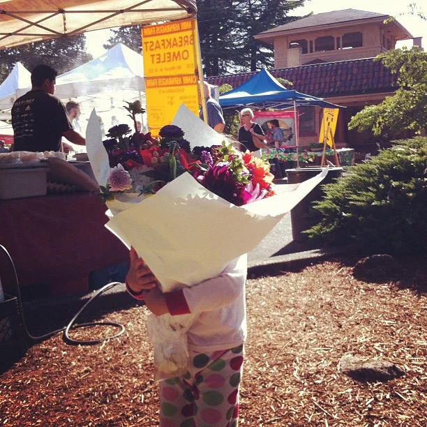 Roza gets some flowers and farmer's market. 
