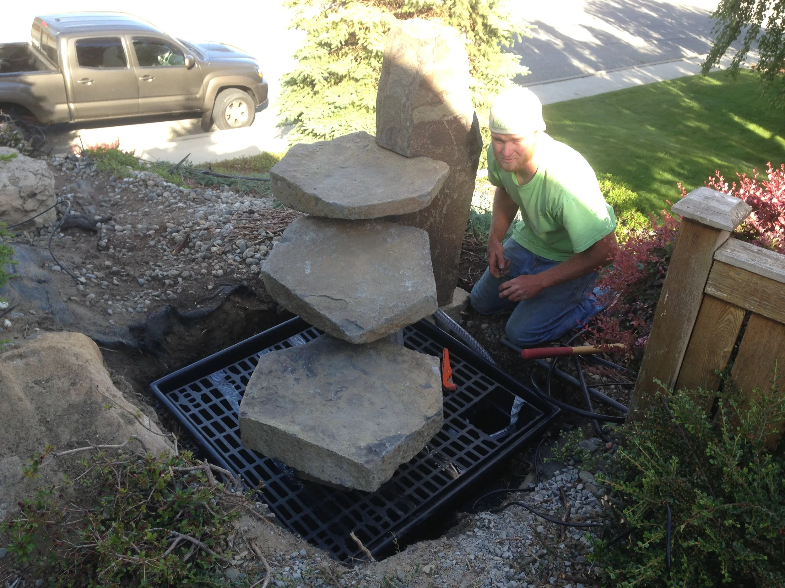 Making our little adjustments before we cover with rock.