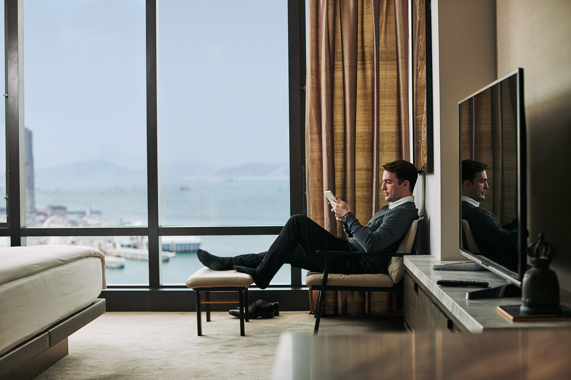 World-of-Hyatt-Leisure-Traveler-Room-Man-Chair-Reading.jpg