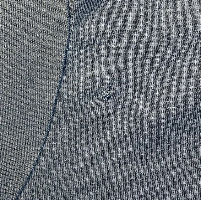 I was upset when I cut a hole in the front of my t-shirt while removing basting stitches. But heck, it&rsquo;s wearable! Sewing realness. 
#notwhatitseams (Images of a steel grey t-shirt bodice and sleeve with a small puckered repair near the seam li