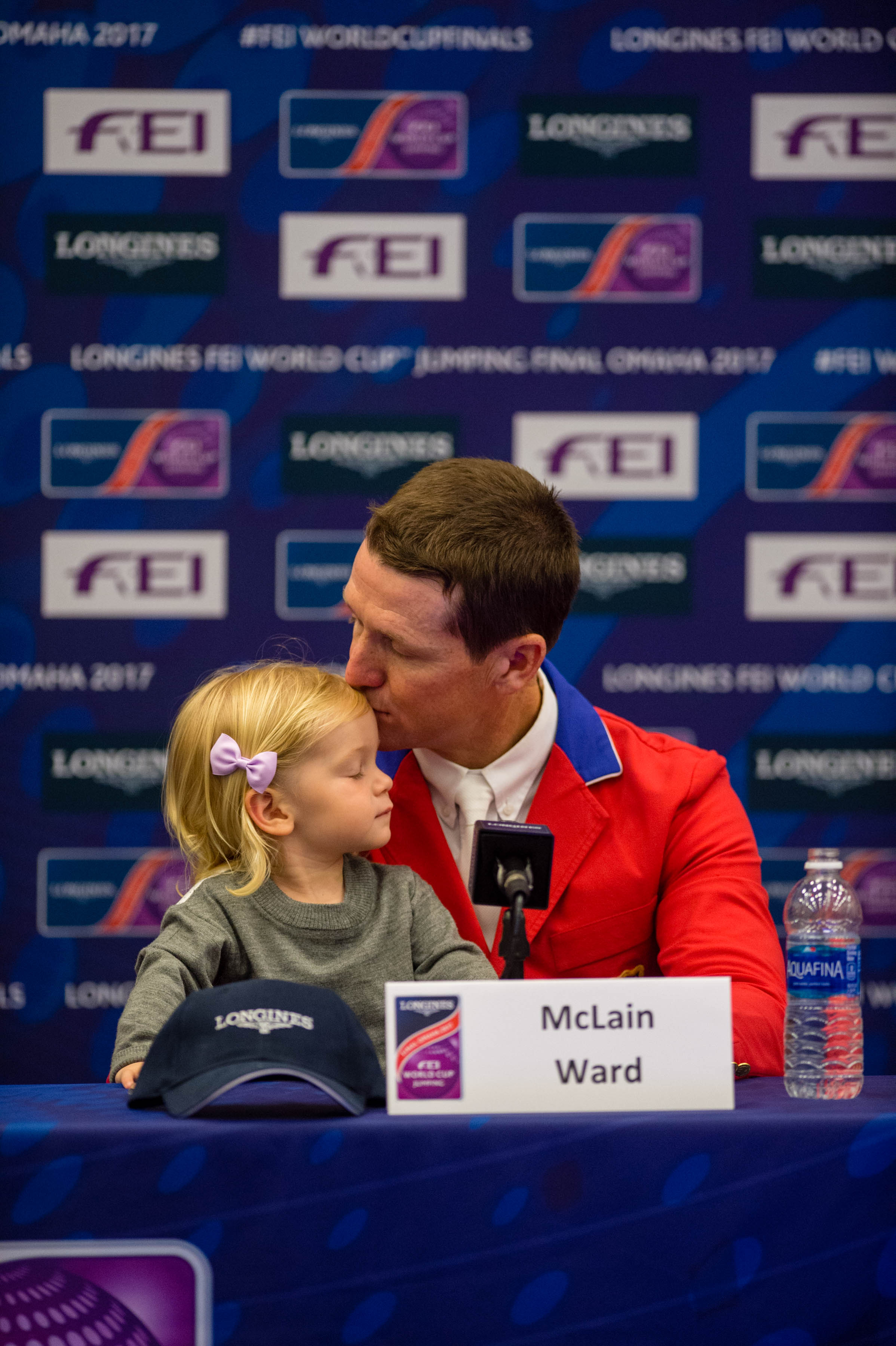  McLain Ward shares a quiet moment with his daughter Lilly during a press conference at the World Cup Finals in Omaha. 