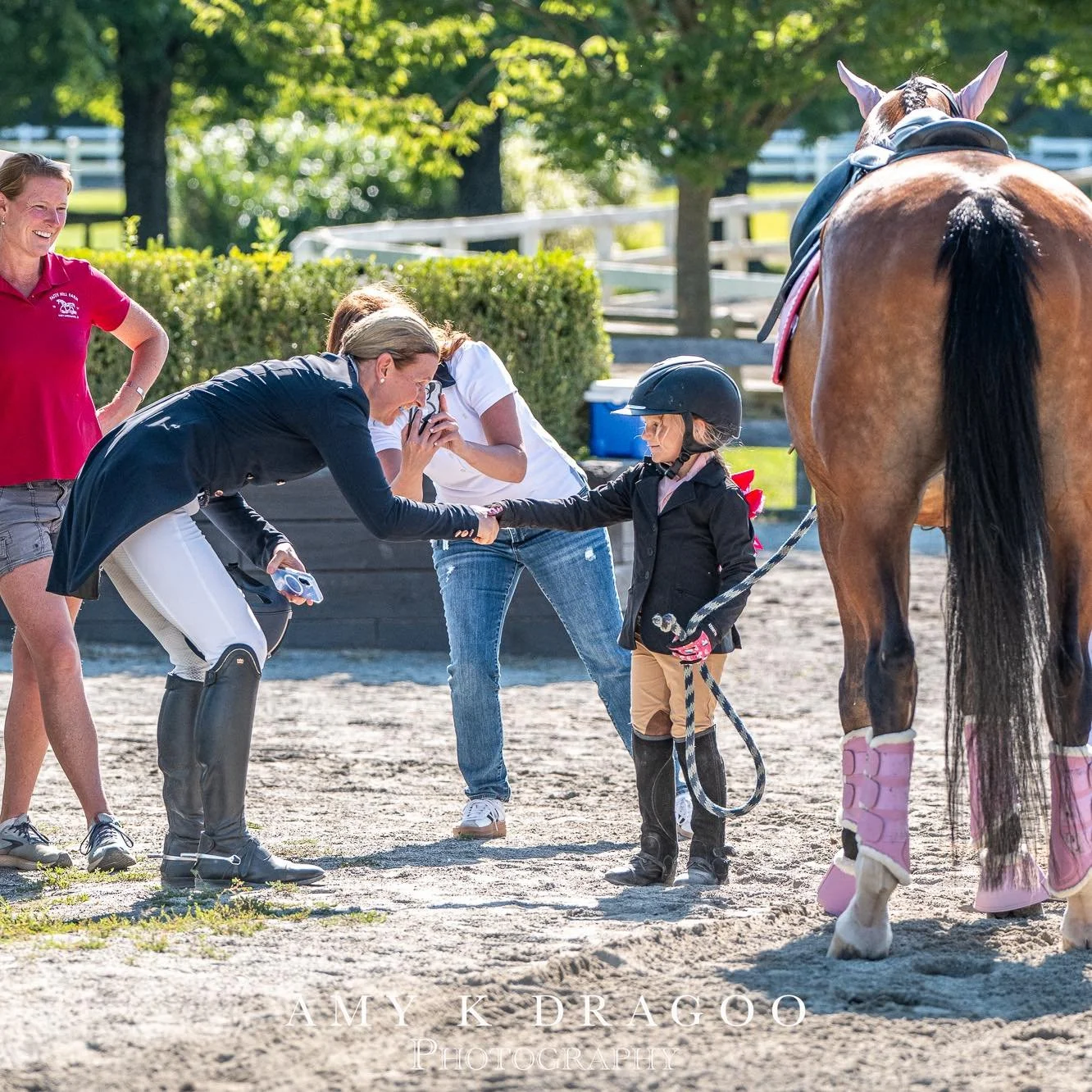 @dancerdressage hands over the reins of her Grand Prix veteran Viveur to Lendon Gray and Dressage4kids leadline competitor Addison at the annual summer festival, this year at the horseparkofnewjersey. #dragoocrew
