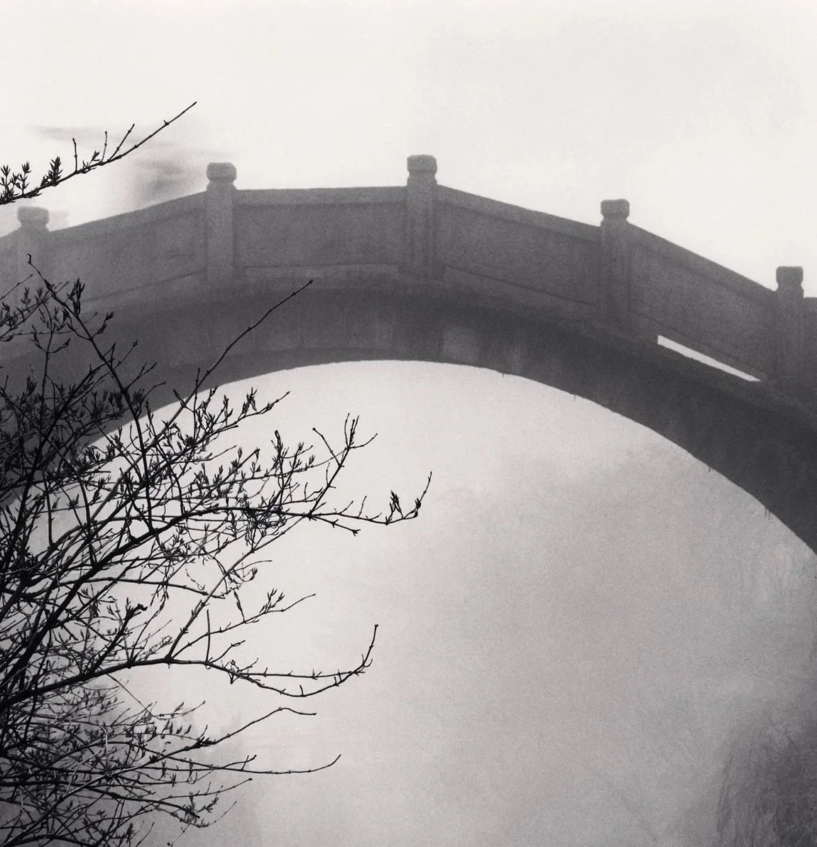 Bridges span rivers, connect cities, and carry us over what once seemed impassable. Where once there was only a divide &mdash; a river too wide, a ravine too deep &mdash; now there is a line drawn through space. 

Michael Kenna&rsquo;s photography is