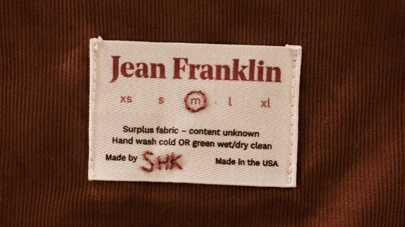 We created a garment tag that would give users a clear sense of where the materials came from, and that each item was custom-made by hand.