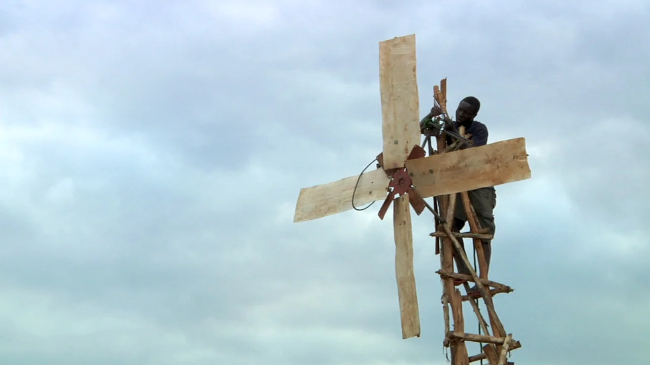William attaches the generator to his windmill.
