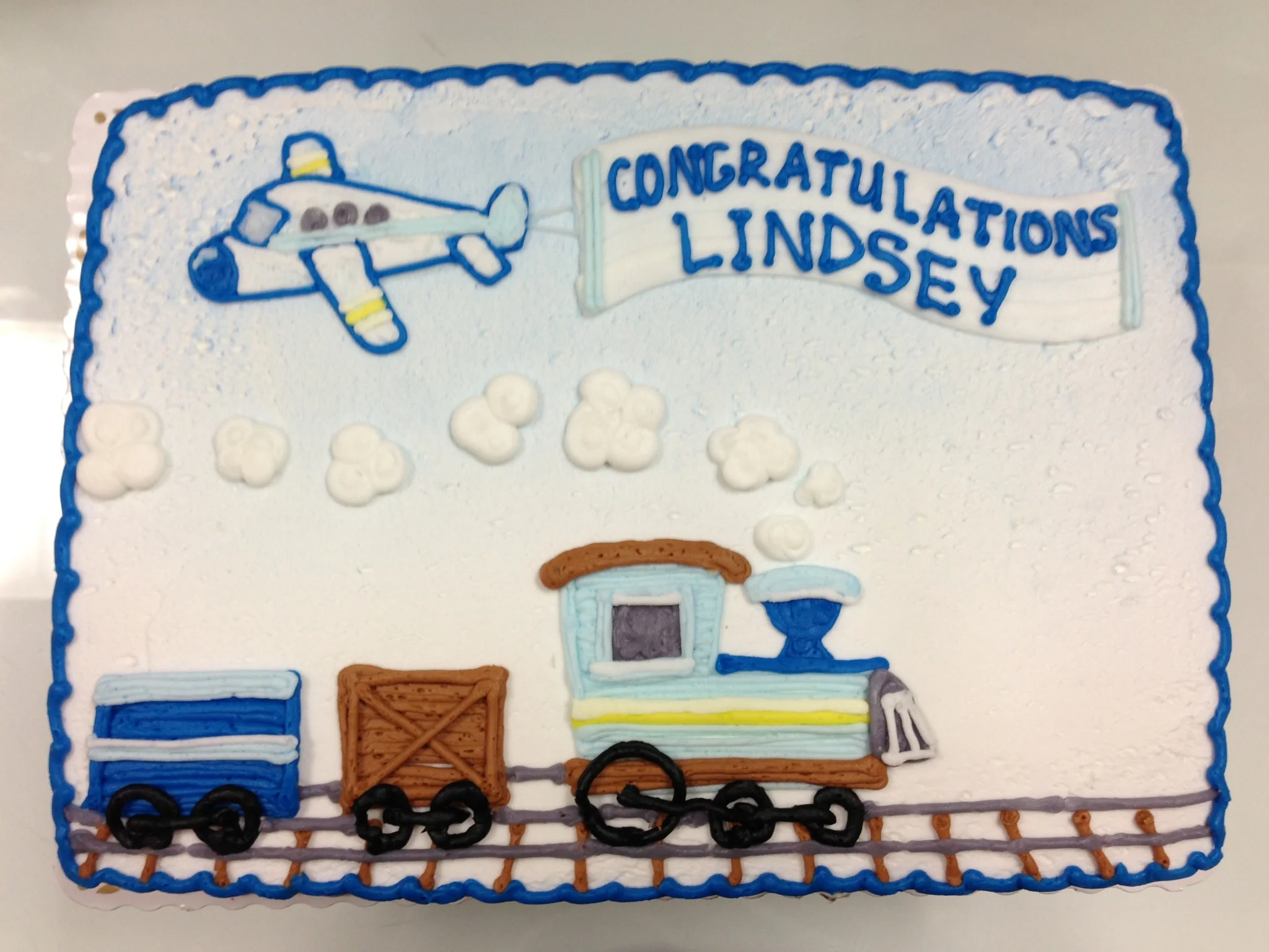 Plane with Banner Message and Train