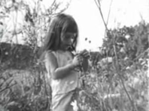 She is counting petals. Her VO dissolves to that of man counting down to zero...