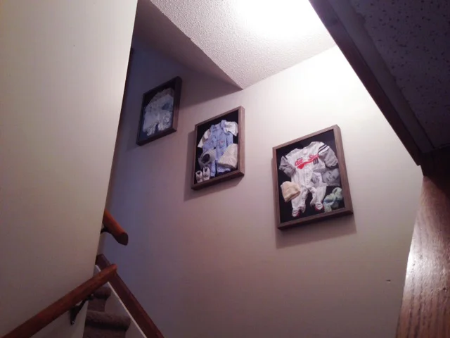 Here they are on the wall which leads down to the basement playroom. It's been bare for two years. Another reason not to wait one more second! Even though I had lots of other things needing to be done. ;)