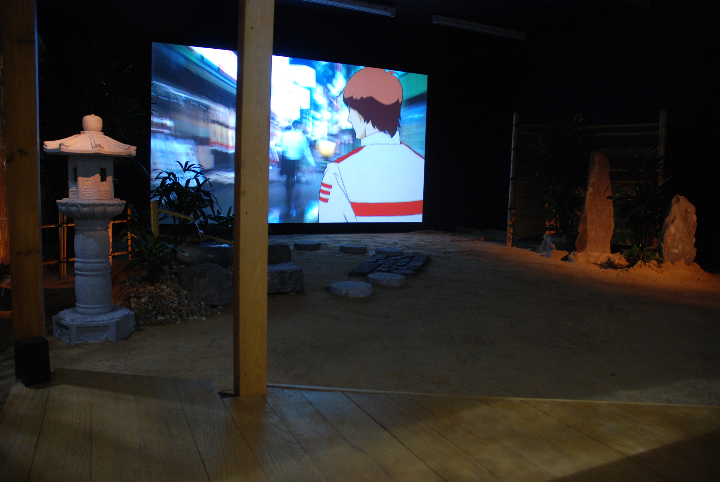 Installation view of film projection and Japanese garden seen from the tea house