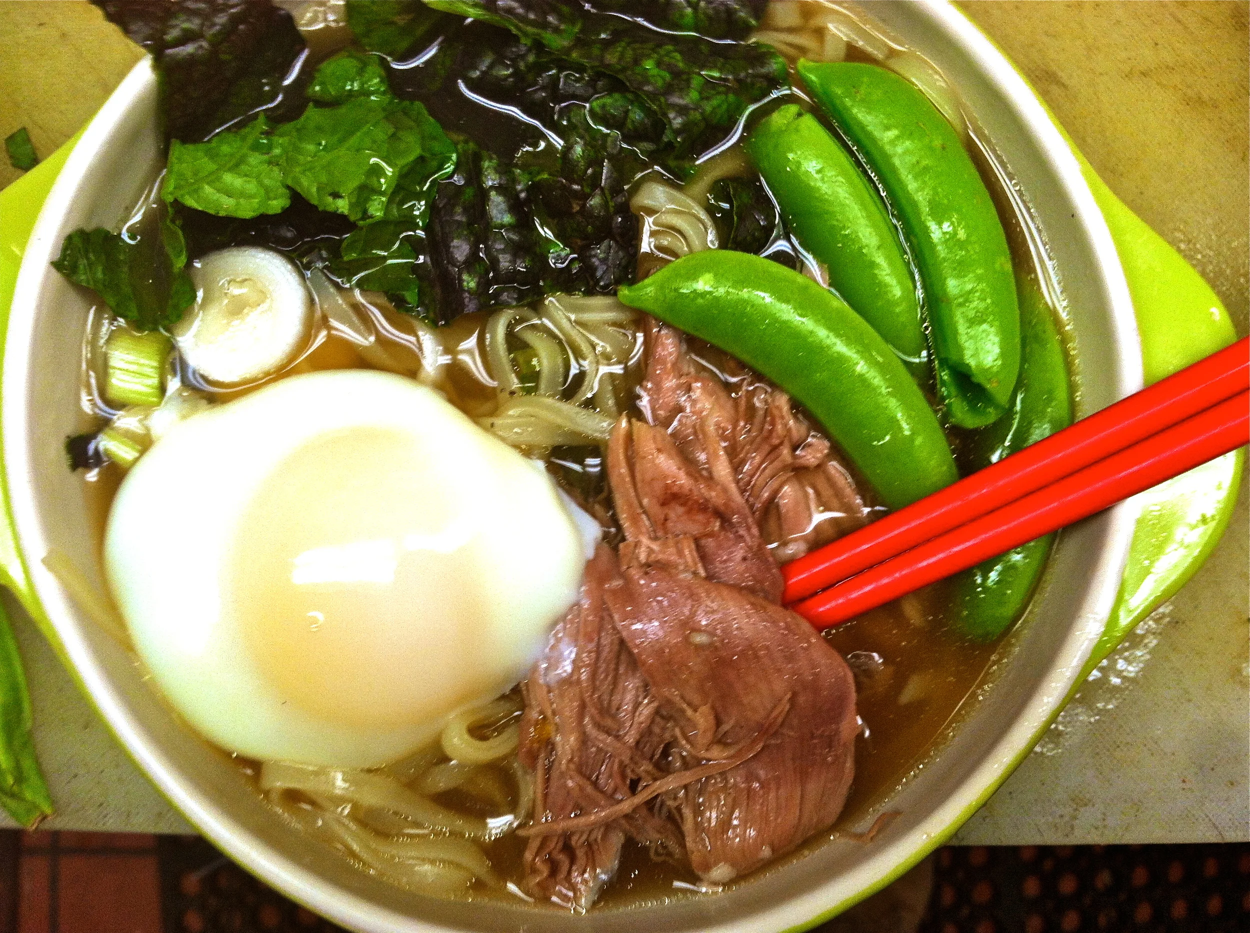 Local peking duck, poached egg, rice noodles, spring peas, mustard greens, radish & leek.