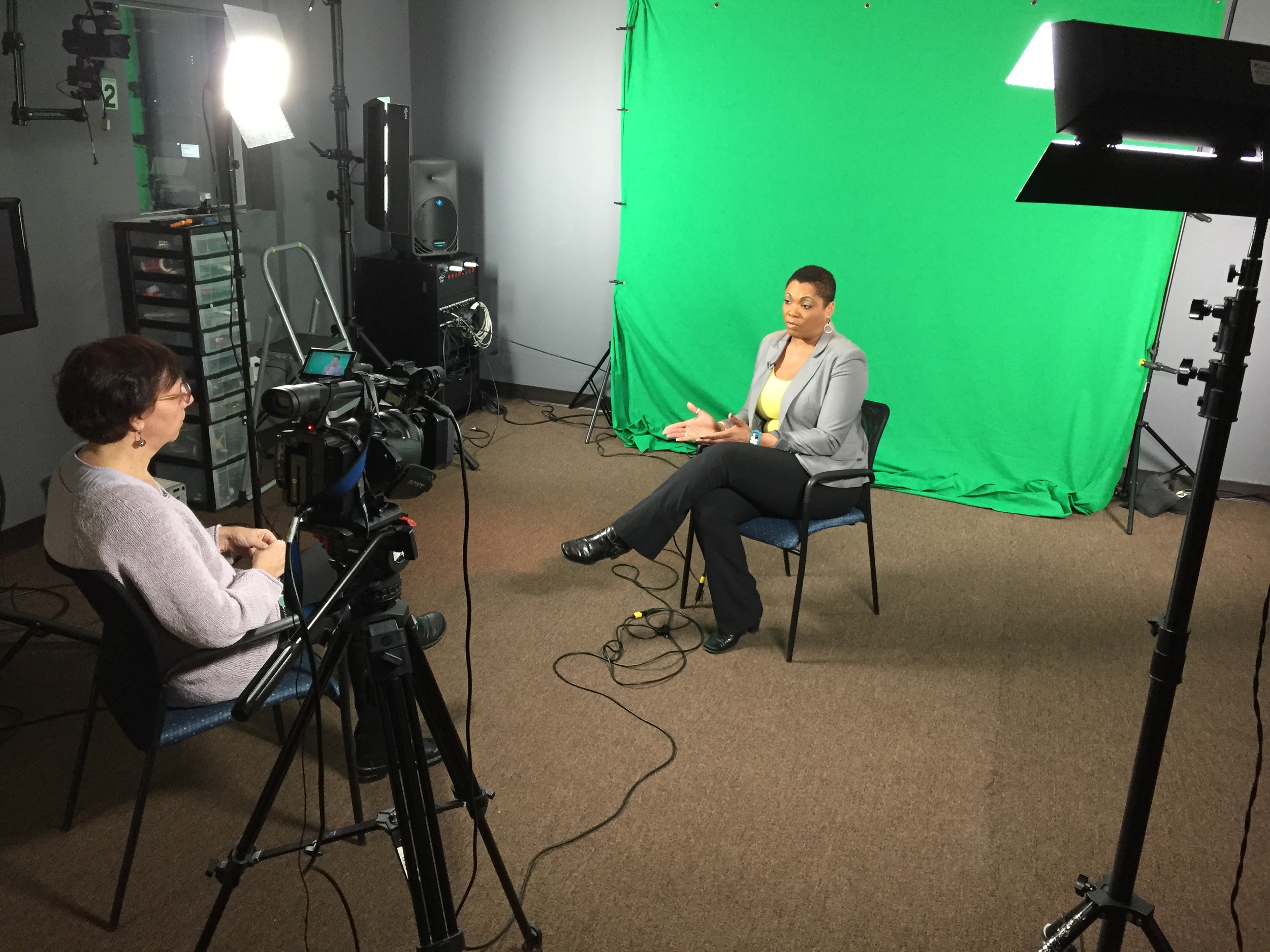 conducting an interview with our PERMANENT green screen set up.