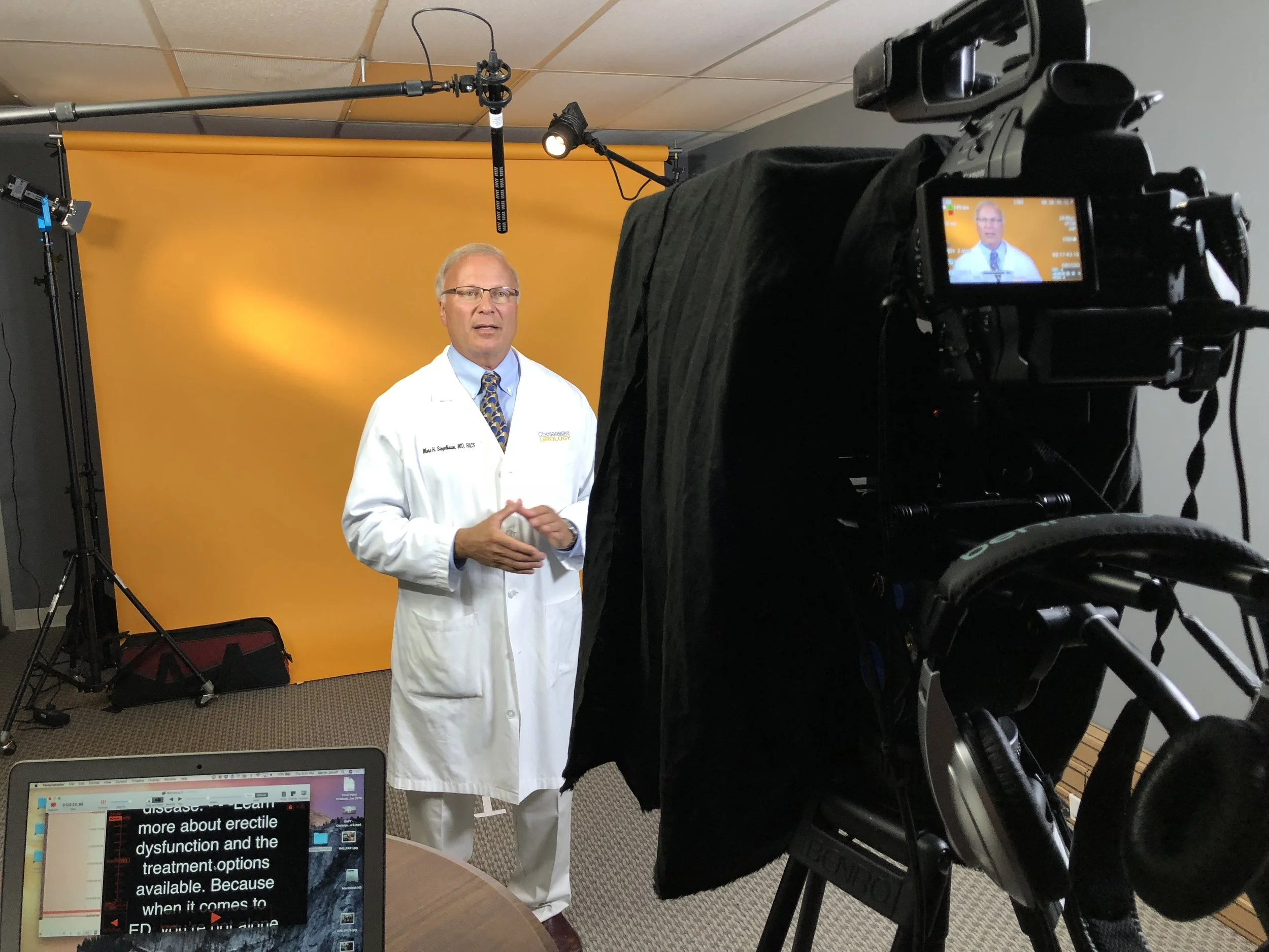 Dr. Marc H Siegelbaum in studio recording a promotional video.