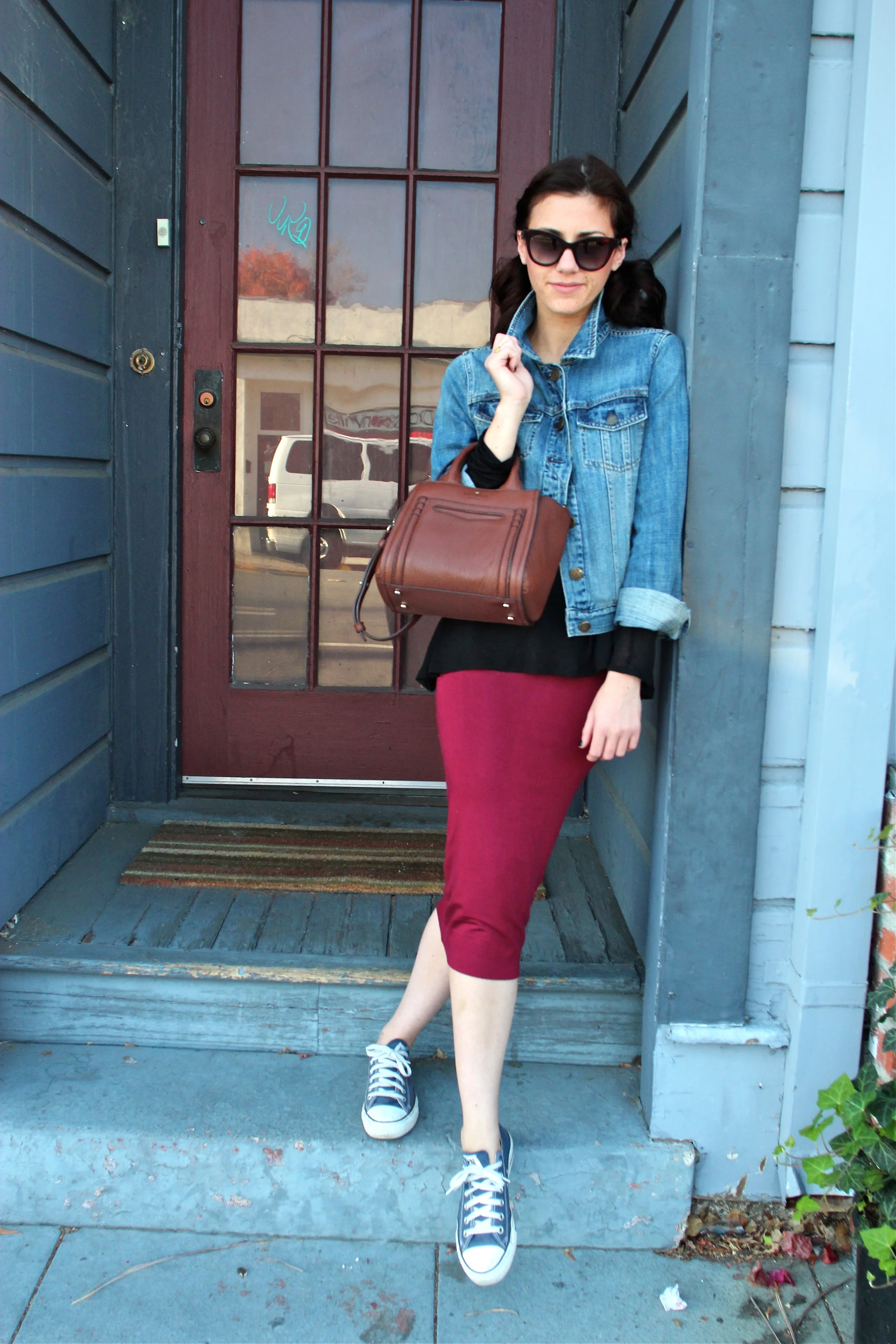 Top: Babaton, Artizia; Denim Jacket: J.Crew; Skirt: Leith, Nordstrom; Bag: Kate Spade, Nordstrom ; Sneakers: Converse; Sunnies: Marc by Marc Jacobs