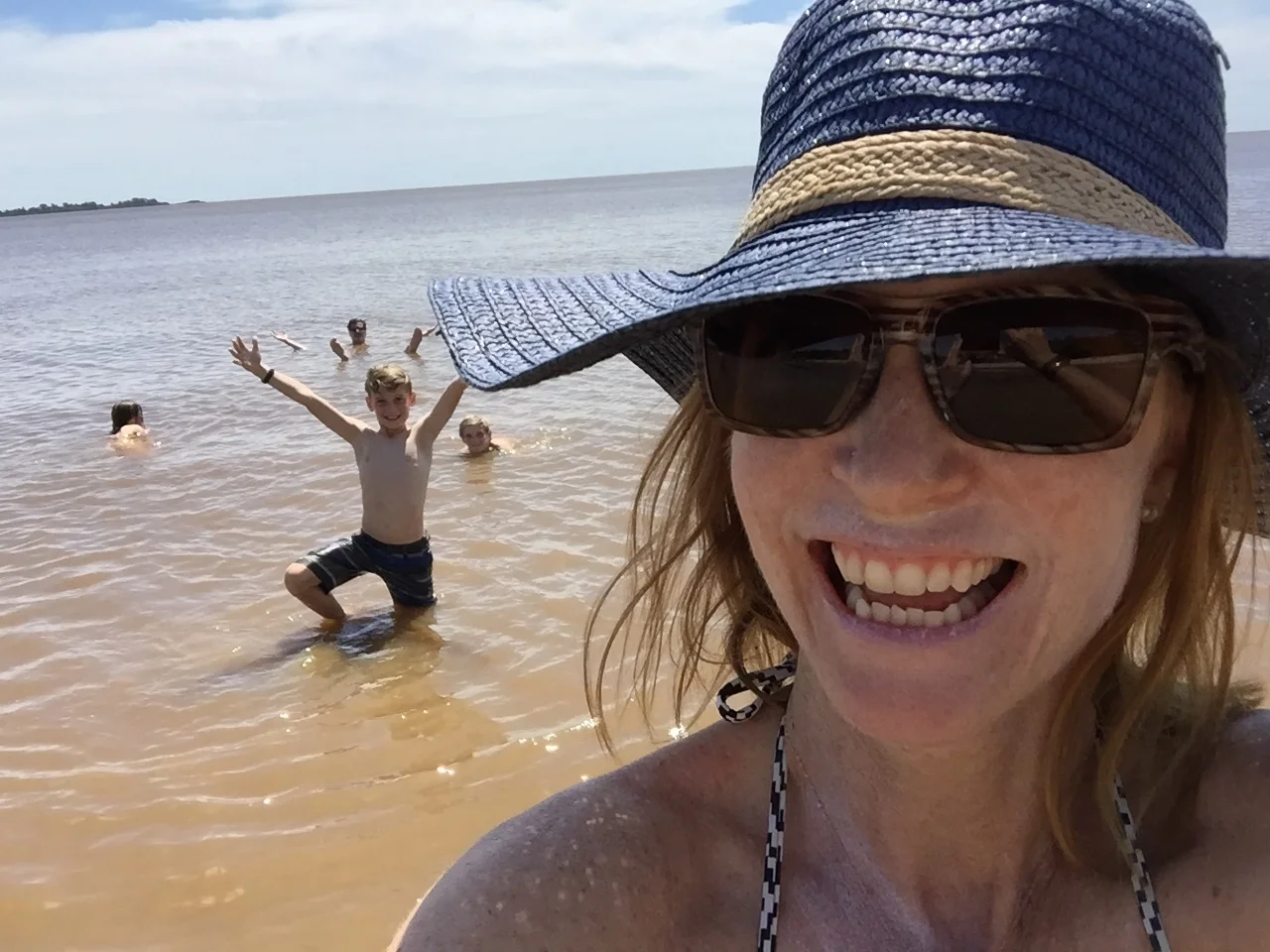 Swimming in the Rio de la Plata off the coast of Colonia del Sacramento, Uruguay