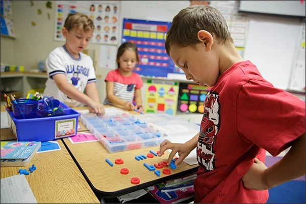 First grader Aston Prieto, 6, uses magnetic letters to form words in Italian at the Franklin International Language Academy in Glendale, Calif. The district, home to seven dual-language-immersion elementary schools, was the first to recognize its graduates for achieving biliteracy. California later adopted a statewide Seal of Biliteracy, the first state to do so. —Emile Wamsteker for Education Week
