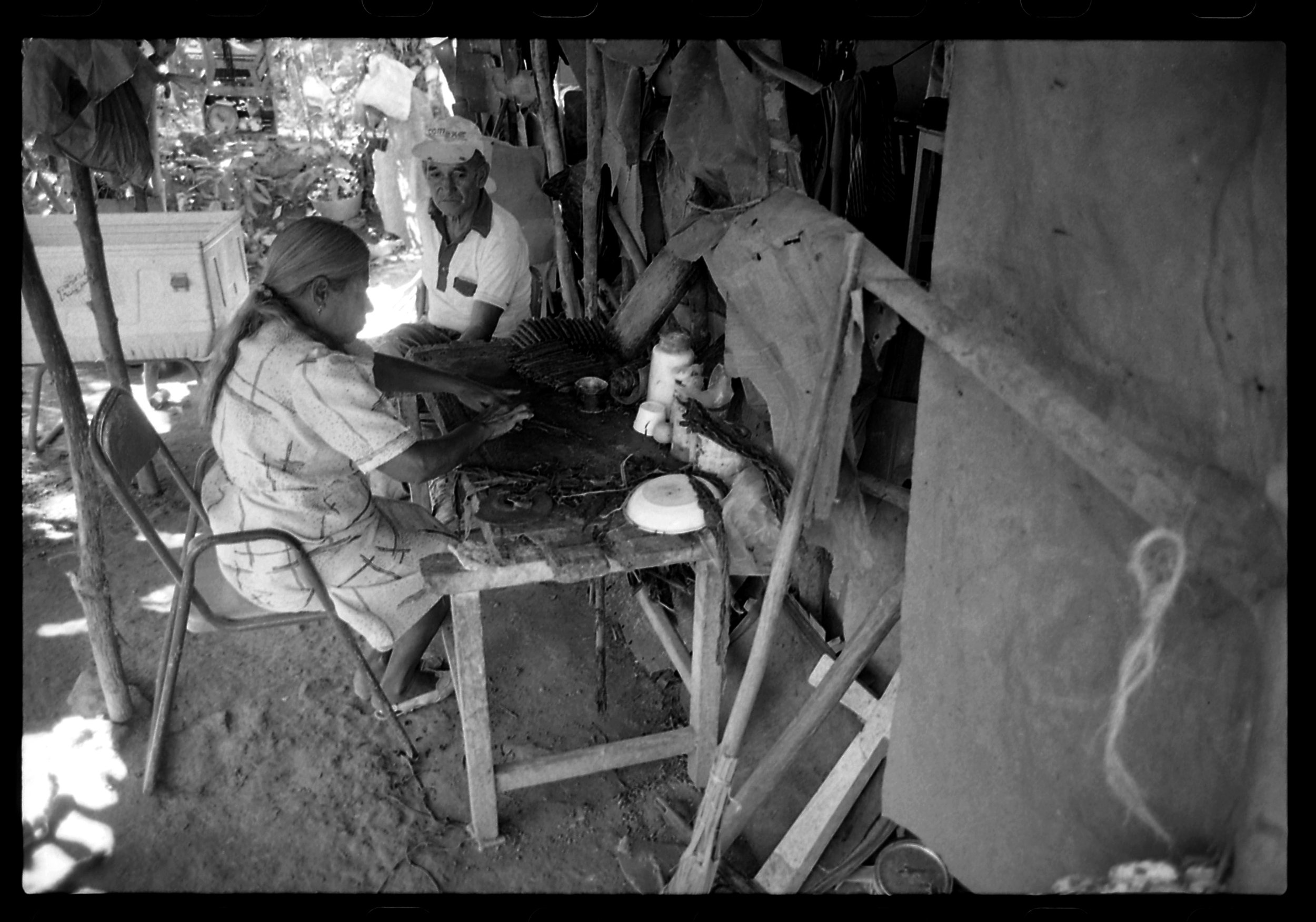  Rolling cigars at home in Simojovel, Chiapas Mexico.  This was a very important money making enterprise for this couple and their invalid mother.  1997 