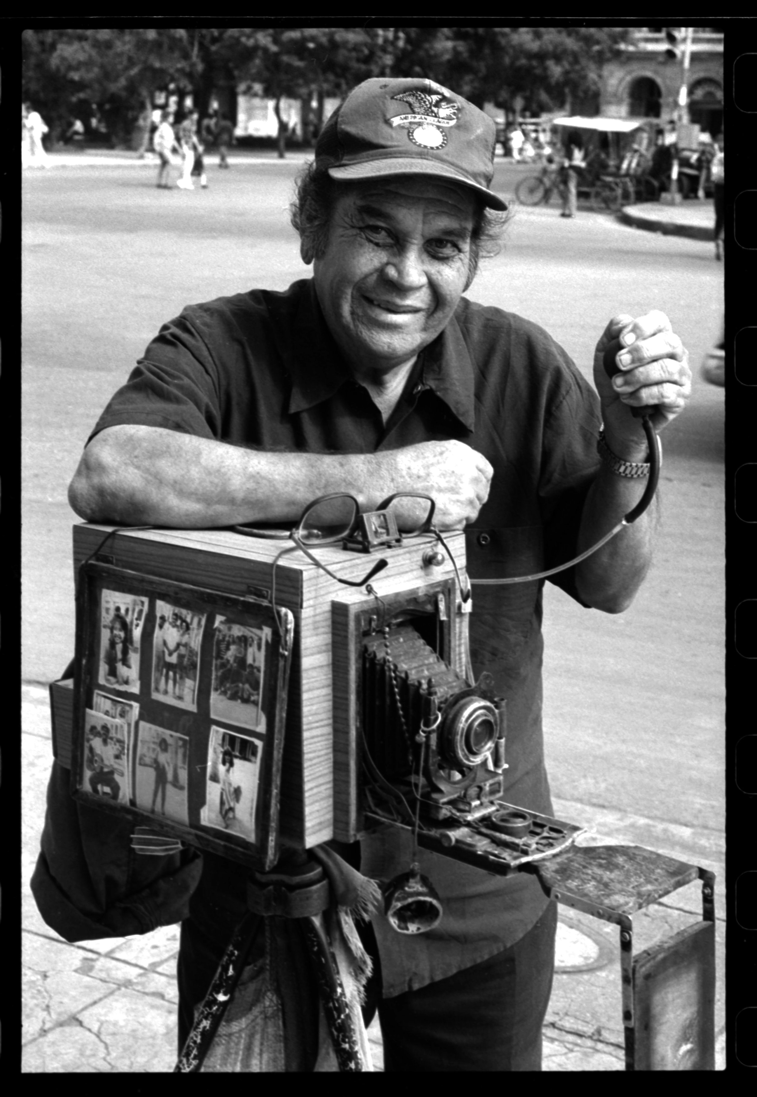 Street portrait photographer using a paper negative process for making prints in order to sell. 