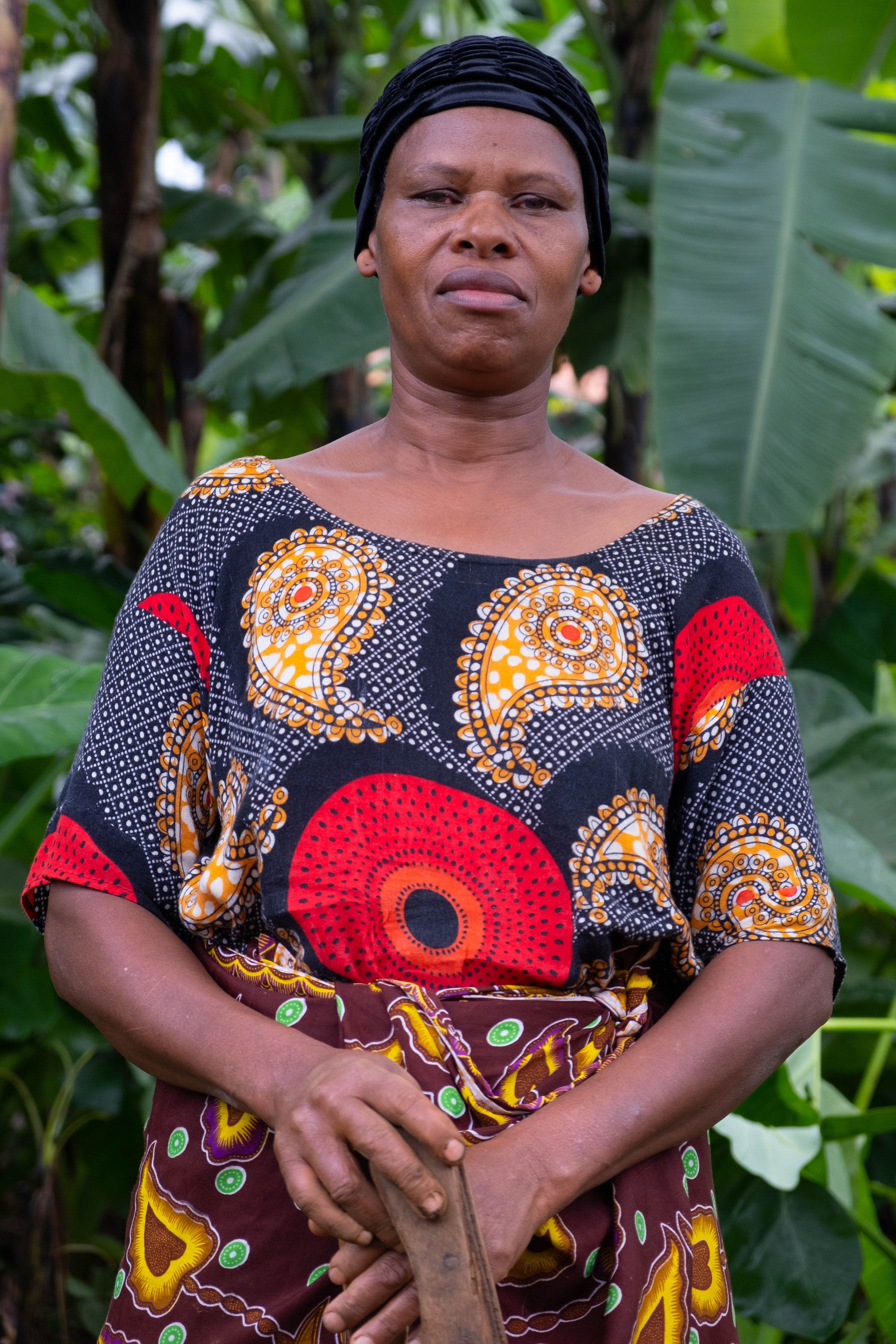  Silvian Martin, age 53, she has been working in coffee production for 30 years.  Materuni Village, Tanzania.  June, 2023. 