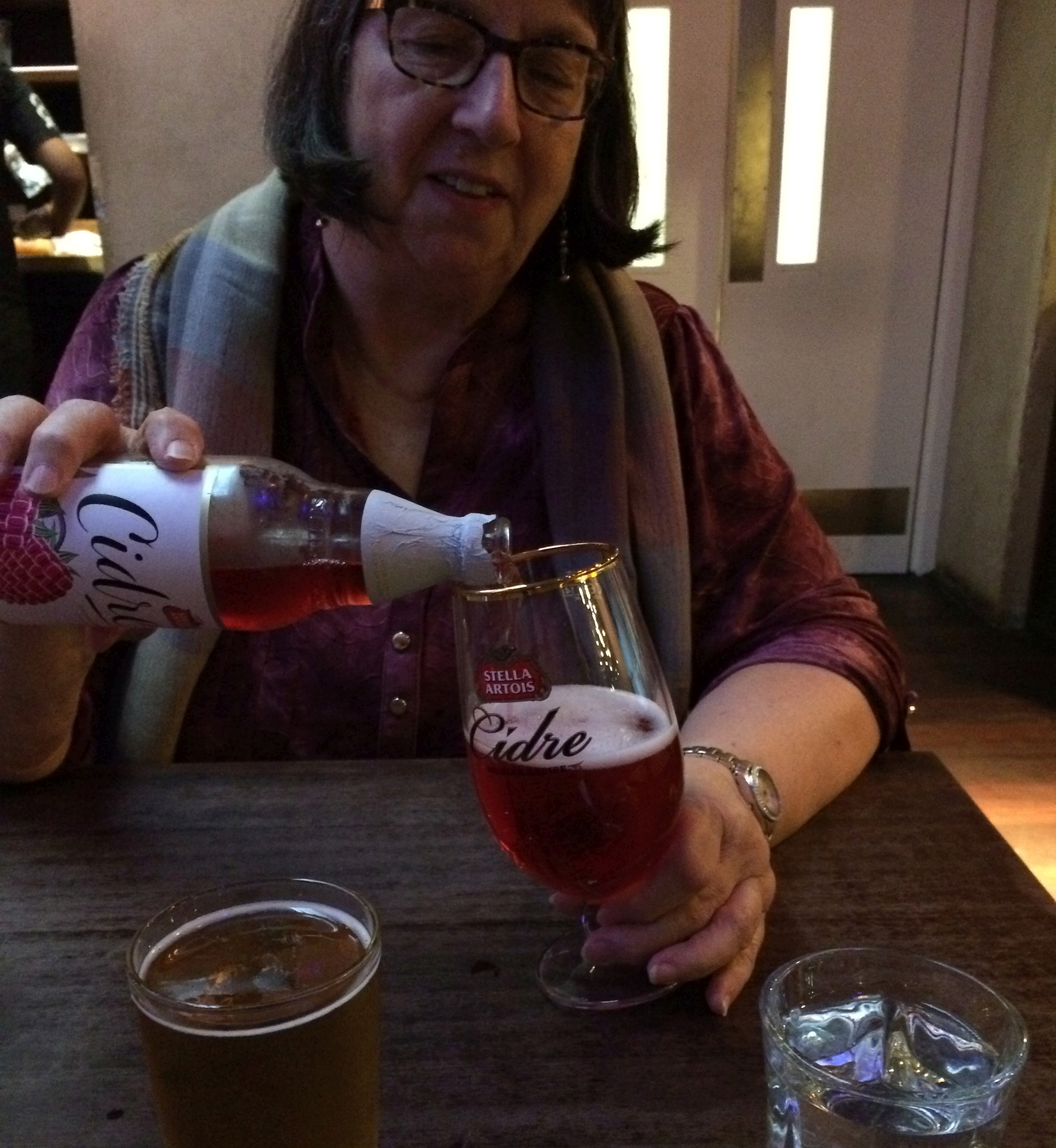 Norah enjoys the largest and sweetest apple cider at the Cafe.