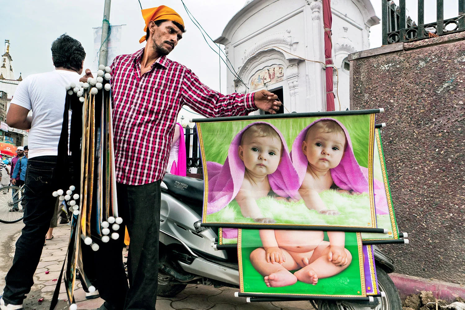 A vendor selling posters in front of the Golden Temple - Amritsar, Punjab, India