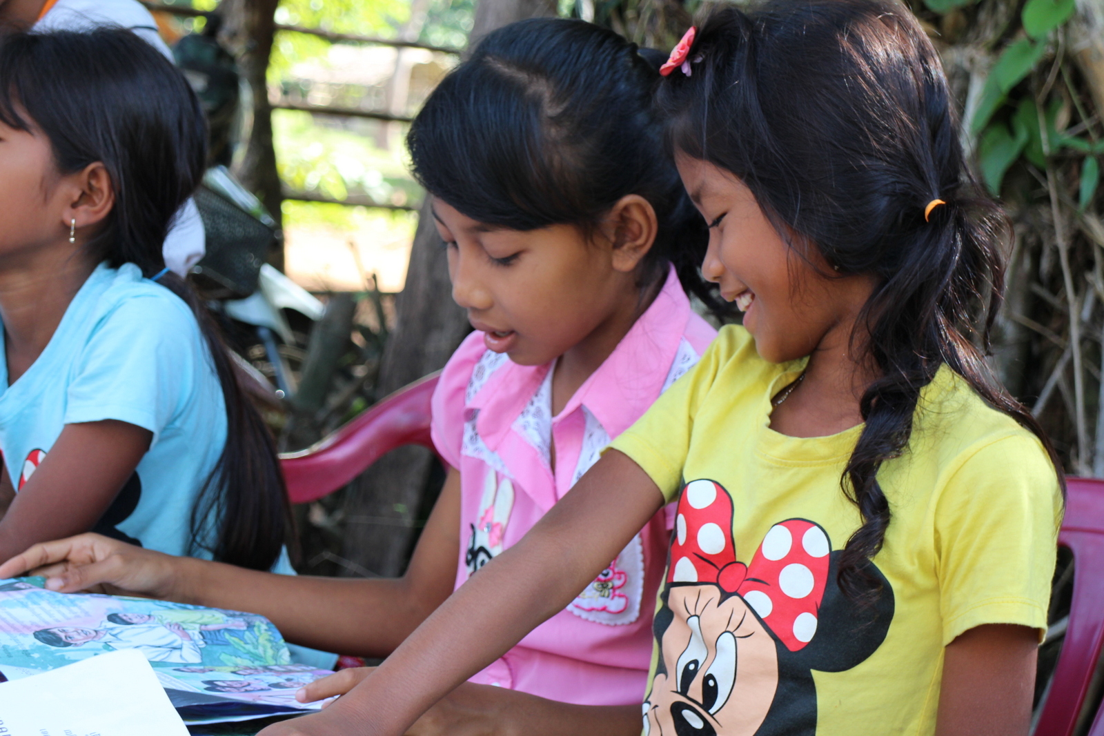 Little sisters enjoying the latest comic