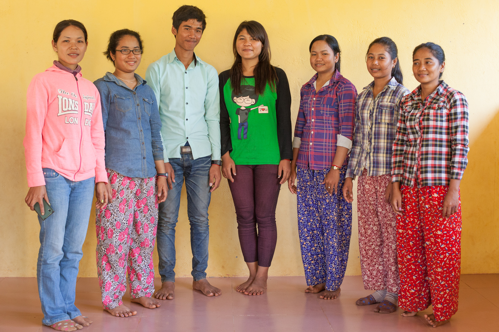 Chanthy, left, with six of the new Alongsiders from her community.