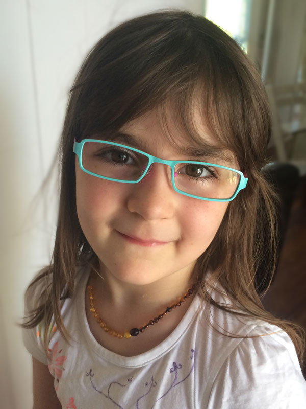 I had the children's eyes tested recently because I had noticed that Lily was leaning close to the computer screen when she was doing her lessons or playing games. It seems she has trouble focusing and needs a little help during her lessons and on the computer. She was so excited to choose these glasses and has no trouble remembering to put them on when she needs them. Is it just me or is she just amazingly beautiful?