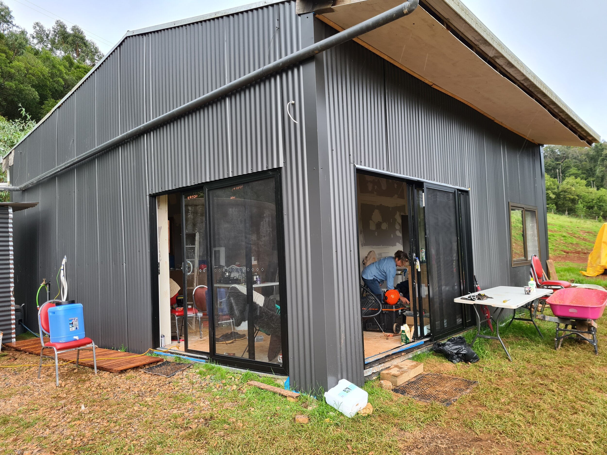 Shed with new cladding and windows in.jpg