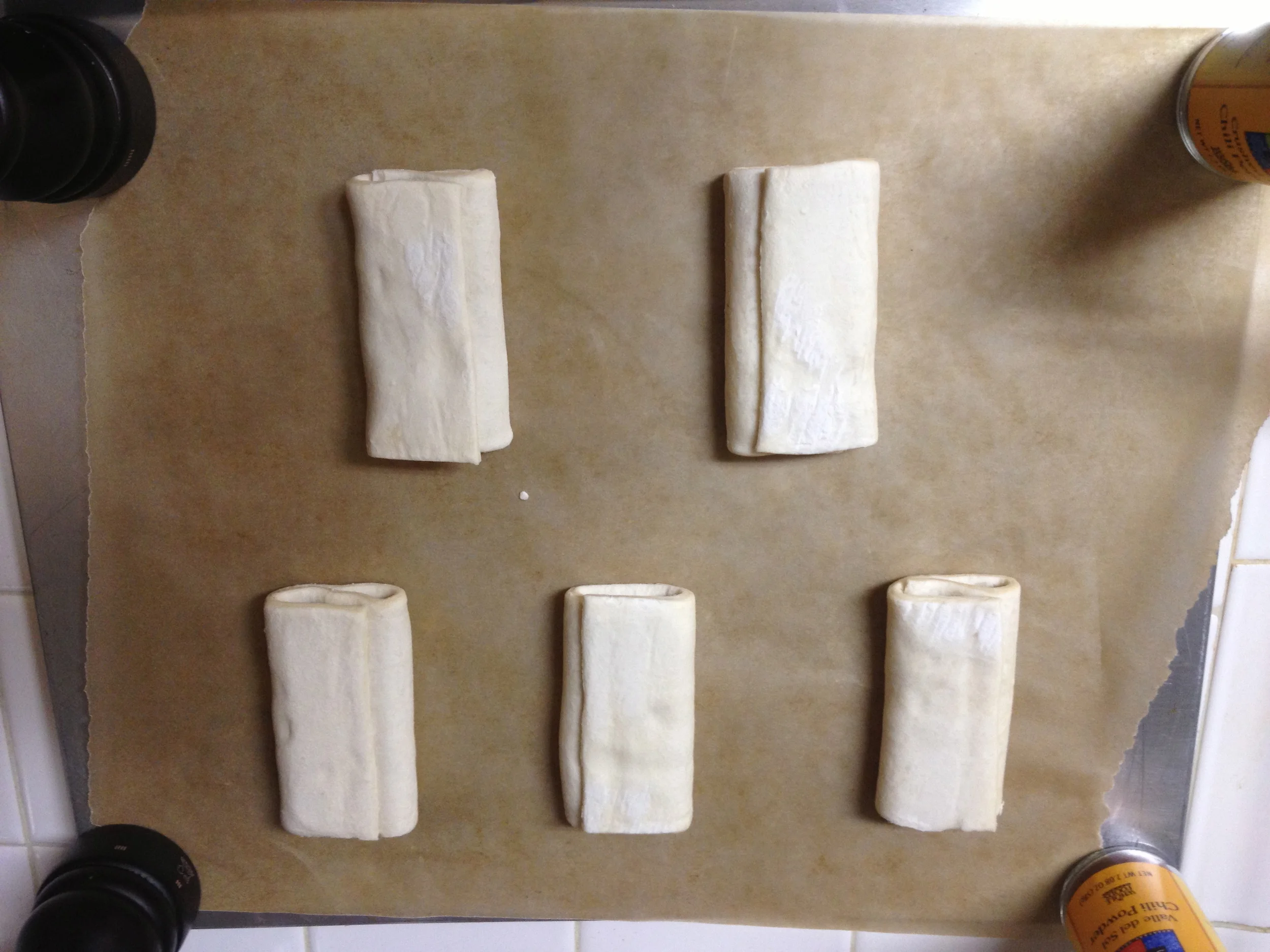 Croissants straight out of the freezer. If you're doing this at home, be sure to let them rise seam side down, so they don't unfold while rising.