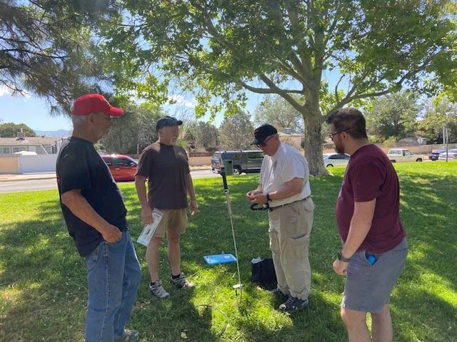 Question:  "How many hams does it take to install one small antenna?"