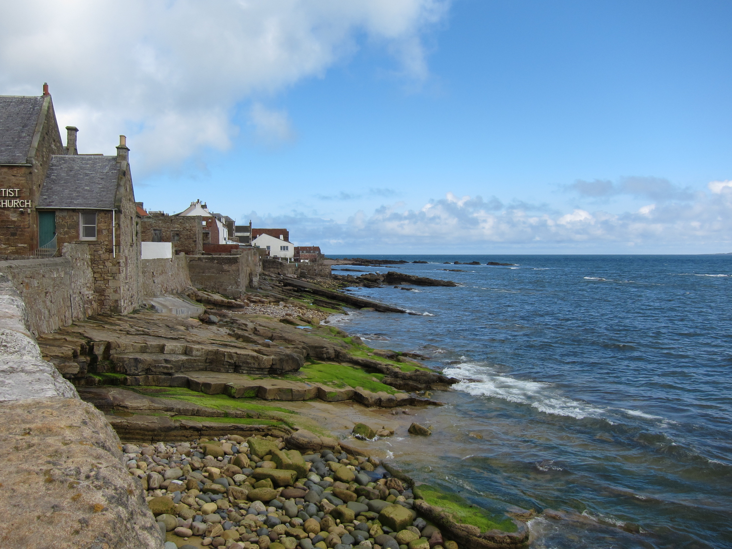 I woke up super early on day 2 to hop on a day trip excursion with a tour group. In hindsight it would be better to rent a (super awesome) car and drive around the highlands and coastal towns for a few days. The road system is really good. And you can see a lot along the way. We went along the kingdom of Fife's coastal towns of St. Andrews, Anstruther, Falkland, and looped back to a tiny waterfront suburb of Cramond. These are not towns you generally see as the face of Scotland (well, except for maybe St. Andrews in the golfing world). They were all super small, quaint, clean, and had the right amount of charm that makes you really wonder why anyone lives in the city.
Bryan, our guide, told us a lot about Scottish history. He used to be a flight attendant, seen the world many times over, and decided that nowhere else is better than home. He possesses the same educated, humble, and warmth that most Scots have. On the way back in to Edinburgh, we drove past a few art museums. All of them are free. From the corner of my eyes for a split second I spotted an installation in one of the museum's garden. I recognized it immediately because I randomly tweeted about it just a few weeks earlier. It was the work of Robert Montgomery . The serendipitous feeling of seeing something you admire online in real life, however fleeting that moment may be, was very special. Turns out Robert is from Edinburgh. In mere 6 words, he summed up his home land oh so eloquently. http://www.flickr.com/photos/kwg73/4196868349/
(Photo credit: KWG73 ) Miracle - an occurrence of something lacking in diligence; an attempt to dietize coincidence.