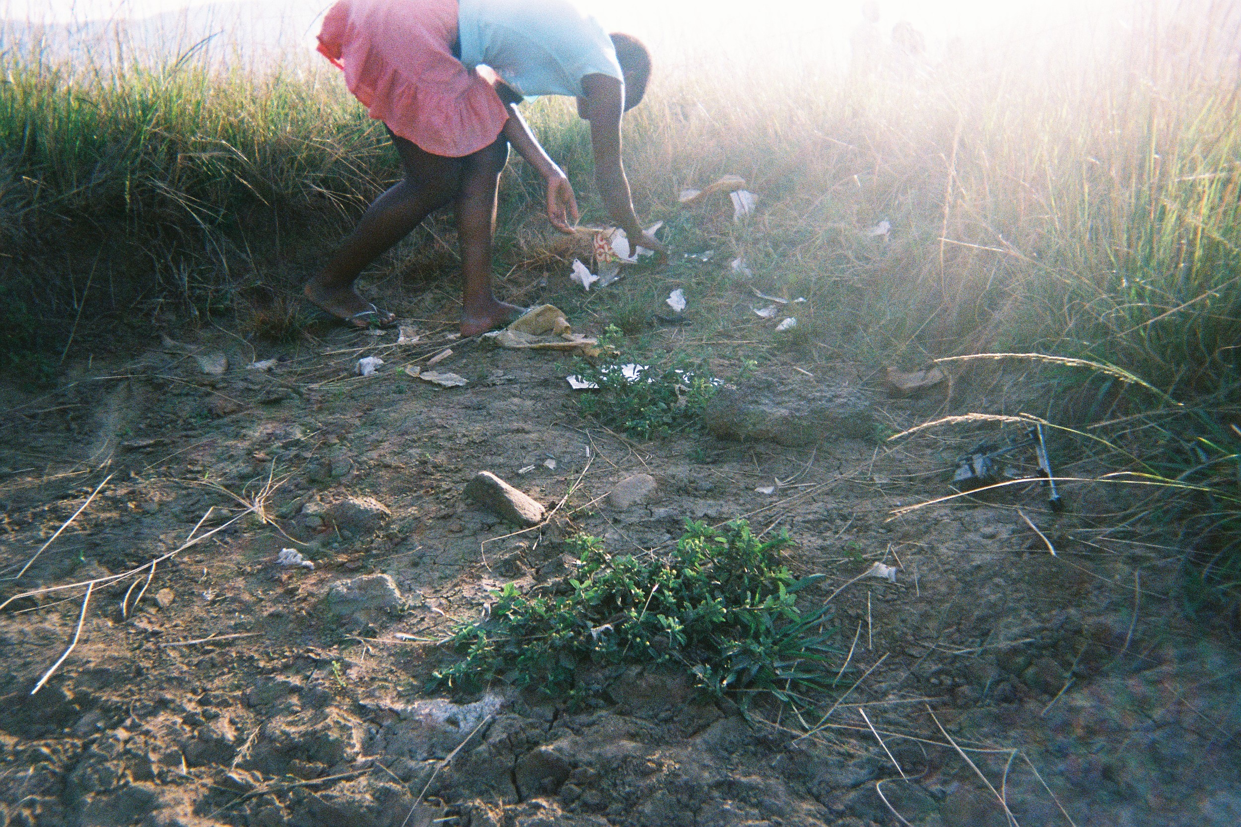 A lady picking up the papers