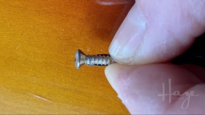Sizing a drill bit to a screw for pickguard holes