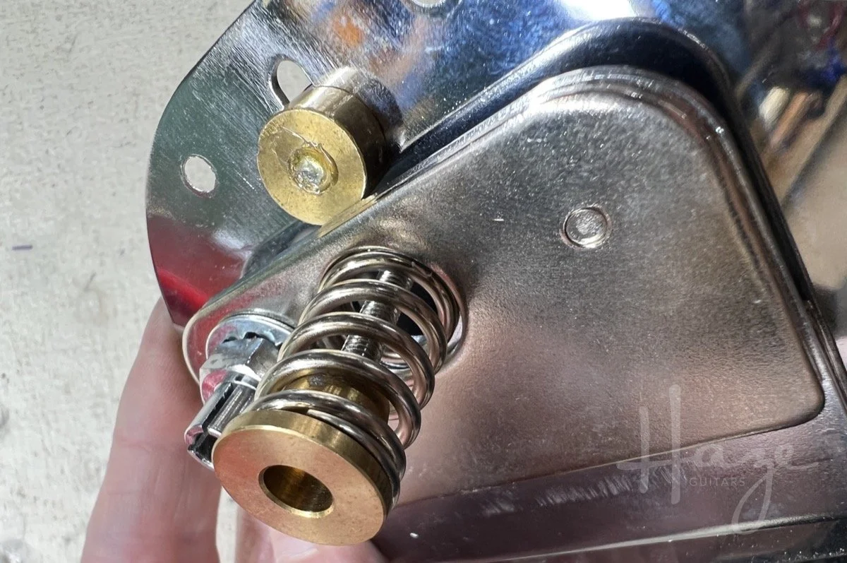 photo showing the trem lock slider engaged in the tailpiece unit