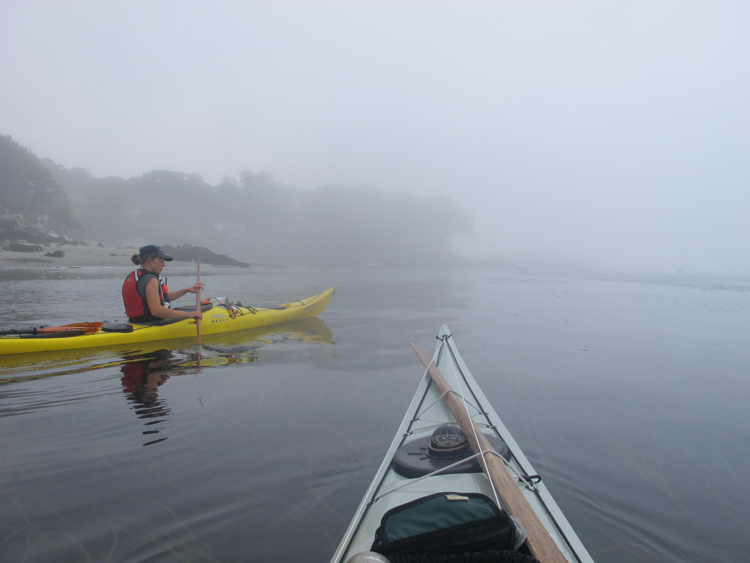 Rounding Brackett Point on the south side of Peaks Island (Pictured: Erin Quigley, Portland Paddle guide, Photo: Joe Guglielmetti) 