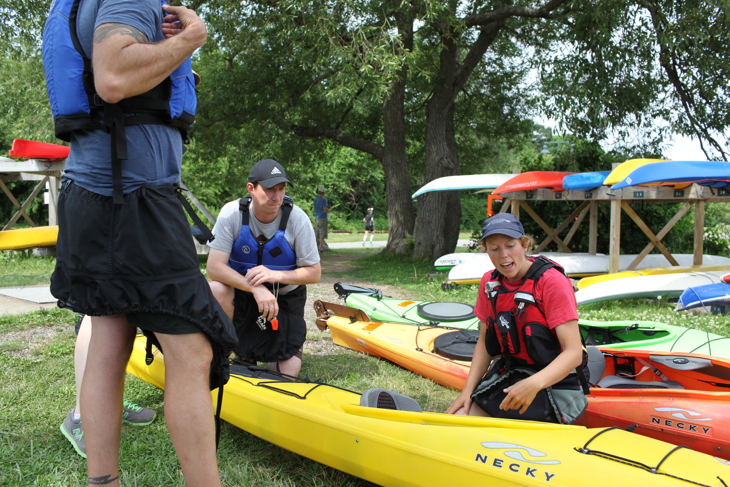 Giving a quick lesson on the parts of a sea kayak