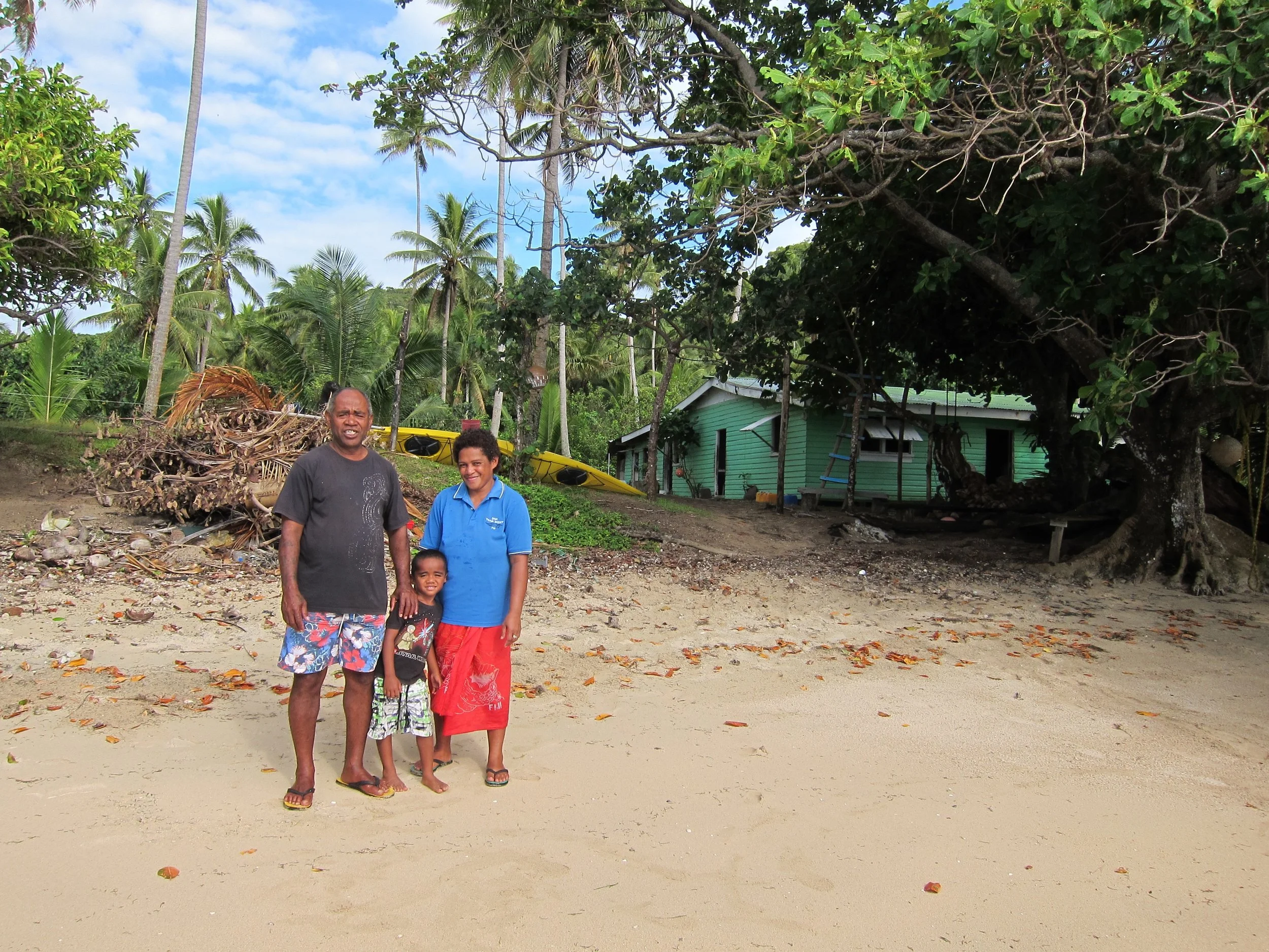 6 Ratu, Tony, and Aliti, their house behind.jpg