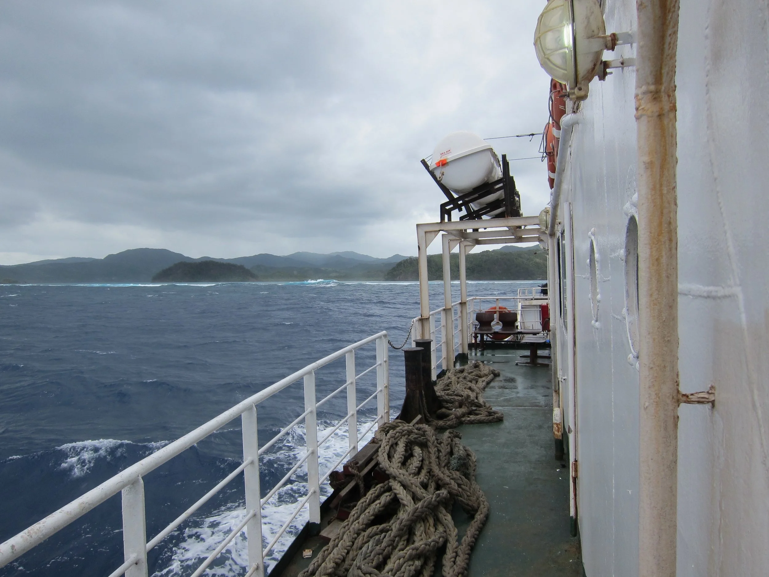 4 The ferry approaching the Great Astrolabe Reef, Kadavu behind (1).jpg