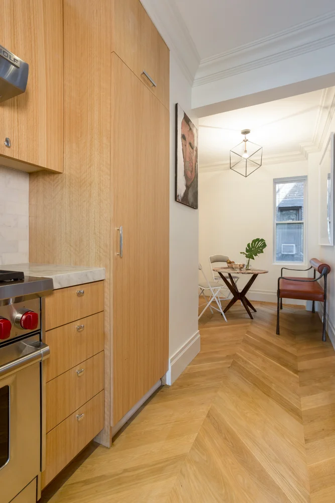Behind the tall door is the stacked washer/dryer unit. (It's a condenser dryer, not vented to the exterior). You can see it peeking out below the door -- I had to get photos before the punch list items were complete!