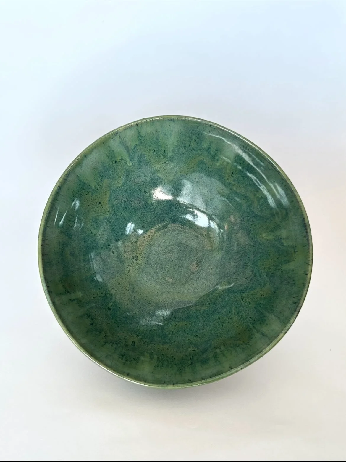 An imperfect bowl with a bright green interior. 

#wheelthrownceramics #wheelthrown #potterylove #ceramicart #spectrumglazes