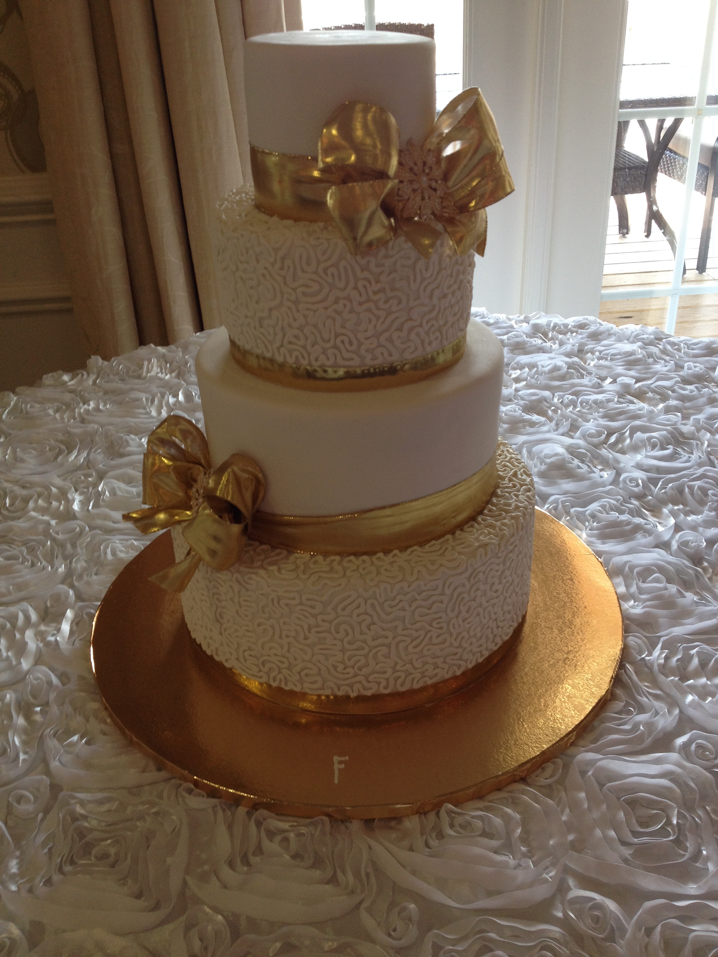Gold Bows with Broach Wedding Cake