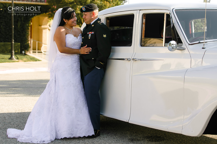 Bride and Groom in front of their Rolls Royce