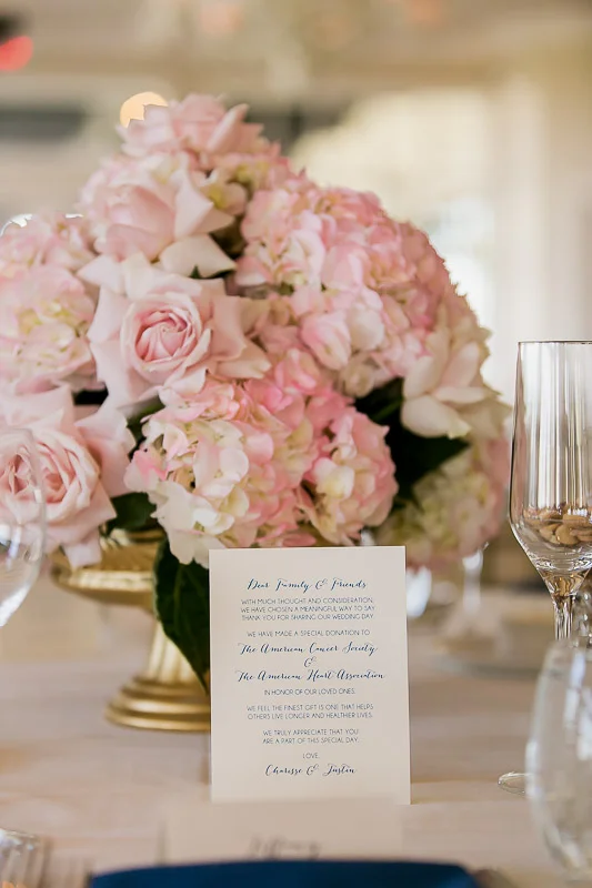  pink and white floral centerpiece with menu at Summit House Restaurant in Fullerton, CA 