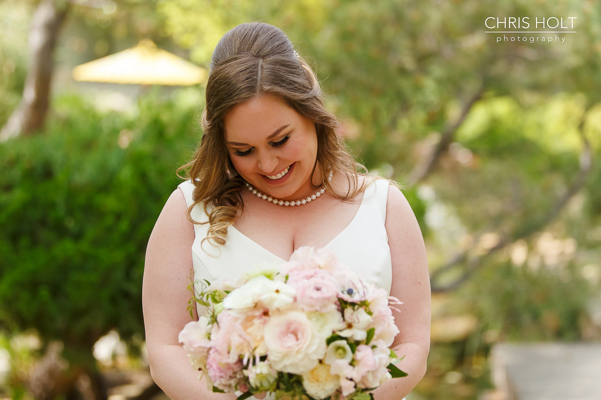  Happy bride with bouquet at Storrier-Stearns Japanese Garden 