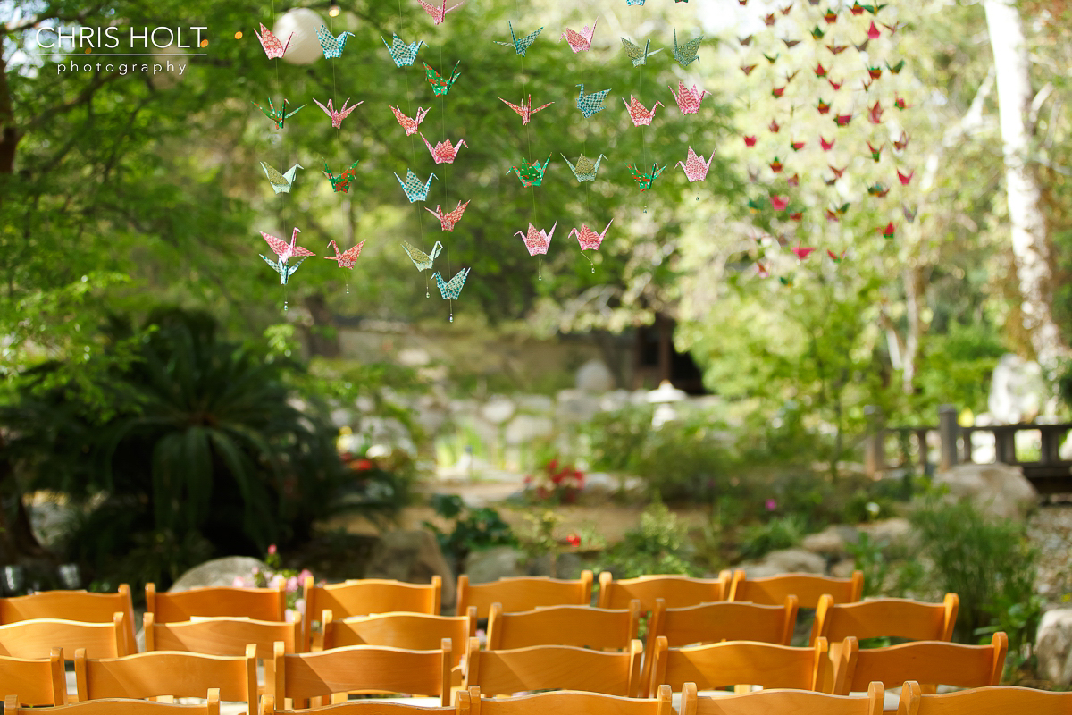  Hanging origami cranes in front of koi pond at Storrier-Stearns Japanese Garden 