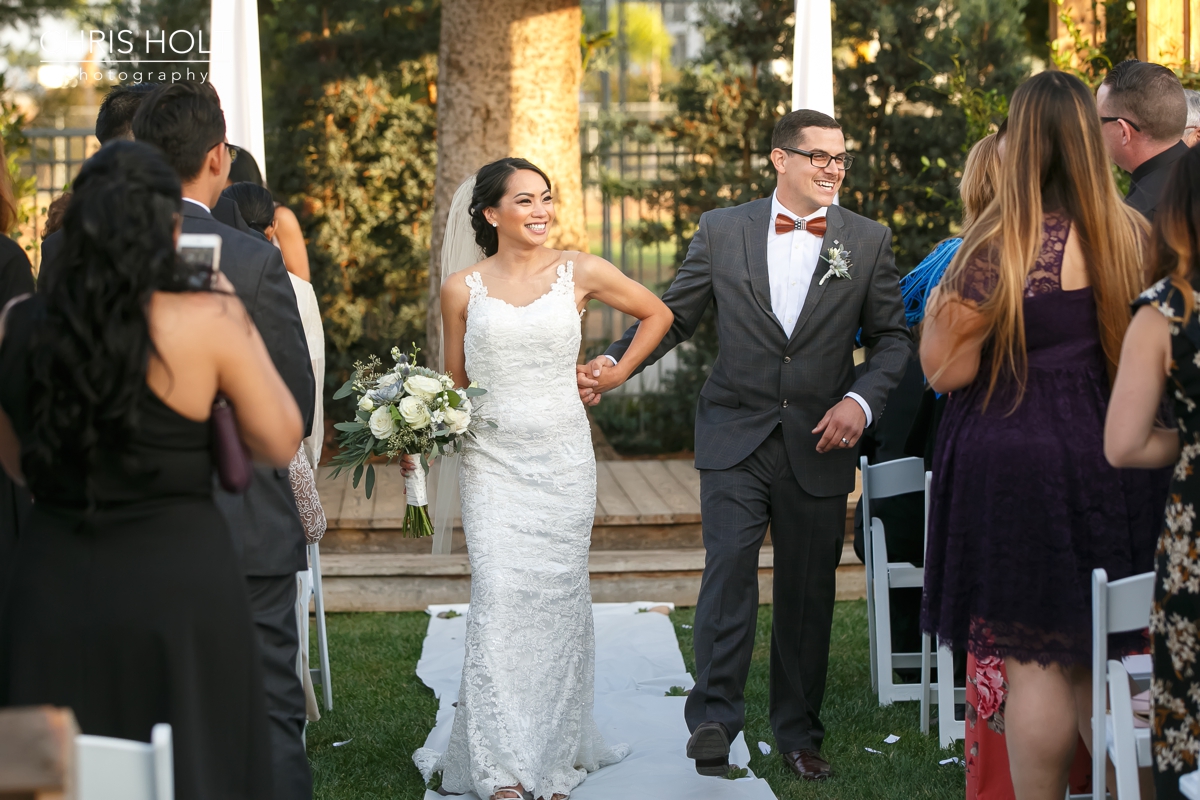 Bride and Groom celebrate down the aisle