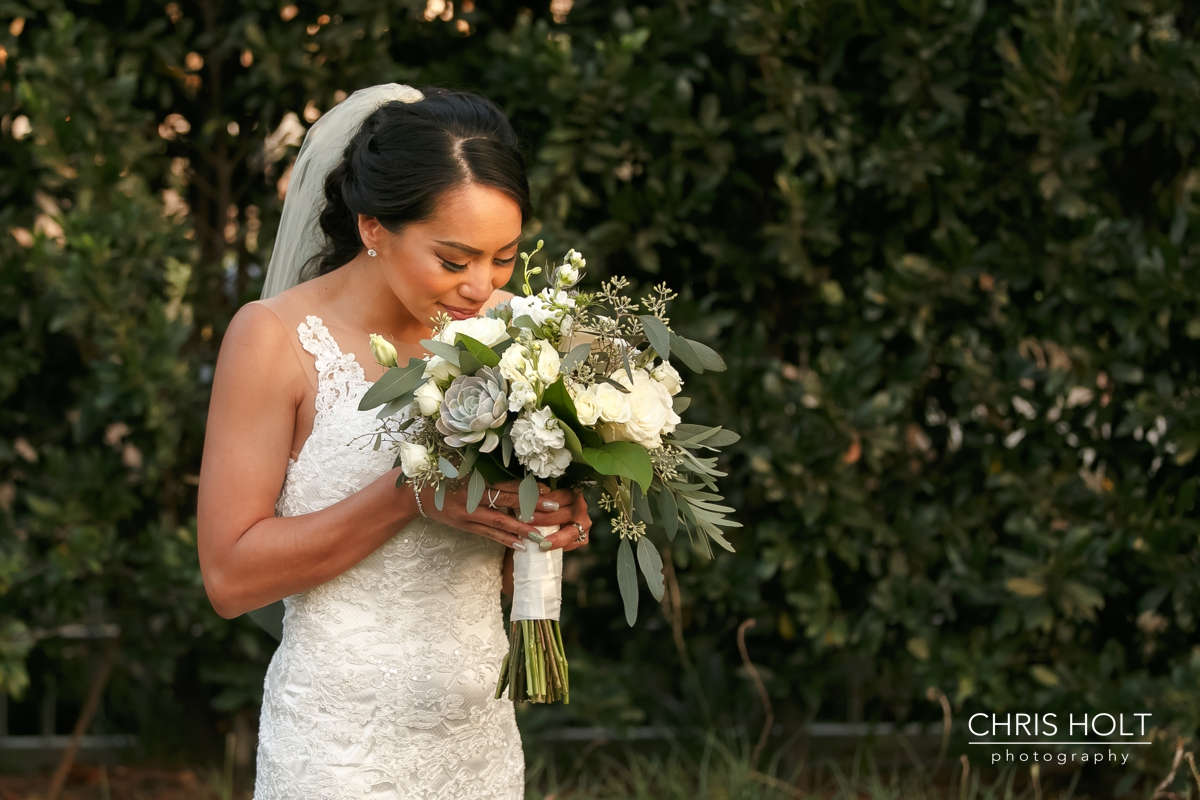 bride smelling her beautiful bouquet