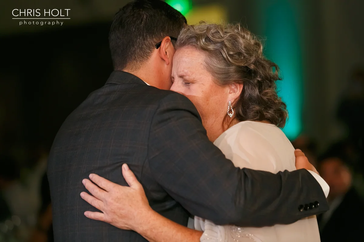 emotional mother dances with her son at Fullerton Community Center