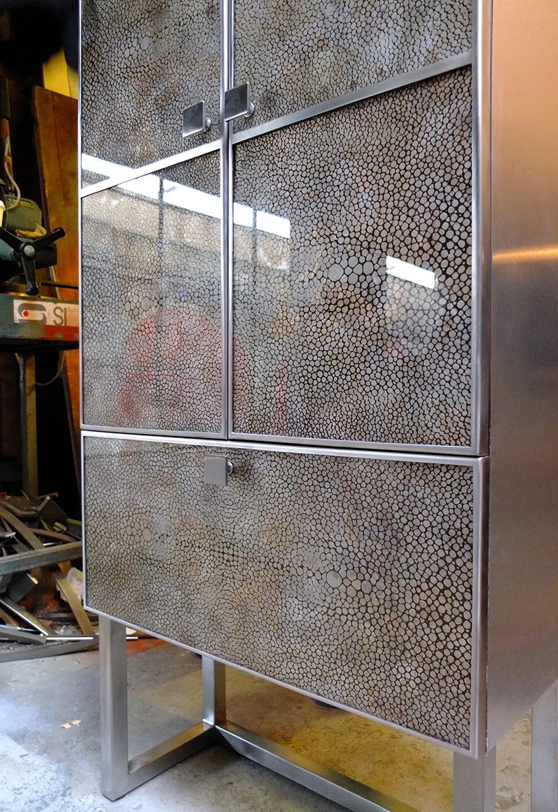 Solid walnut, stainless steel and verre églomisé glass tall boy cabinet. Handmade in London by Nocturne Workshop and Studio Peascod.